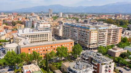 Naklejka premium Aerial view of Palazzo Emme in Latina, Lazio, Italy. The building has the shape of an M like Mussolini's initial. It is a symbol of the rationalist italian architecture of the fascist period.