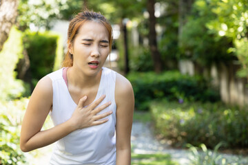 Naklejka premium sick woman with heart attack, acid reflux or gerd symptoms
