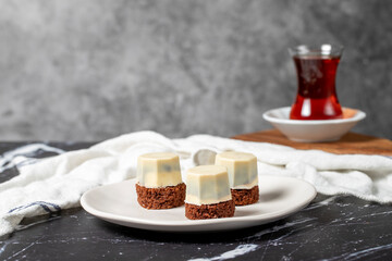 Cookies covered in white chocolate. Liquid chocolate chip cookies on a dark background
