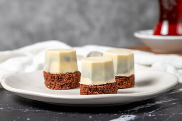 Cookies covered in white chocolate. Liquid chocolate chip cookies on a dark background. Close up