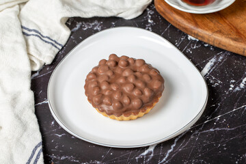 Chocolate pie. Hazelnut, cream and chocolate pie on dark background