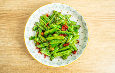 A home-cooked dish on the table dry-stir-fried green beans