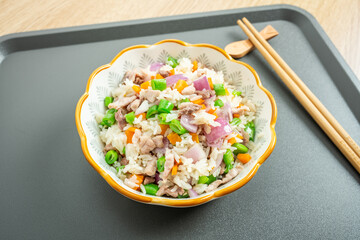 A plate of homemade colorful meat fried rice