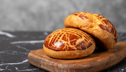 Pastry on dark background. Local name sade pogaca. Copy space