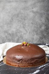 Chocolate cake. Homemade cake with cream inside and outside covered with chocolate