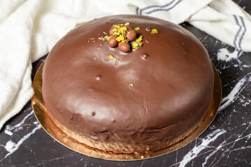 Chocolate cake. Homemade cake with cream inside and outside covered with chocolate. Close up