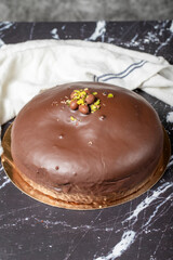 Chocolate cake. Homemade cake with cream inside and outside covered with chocolate