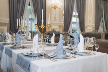 Table decorations for holidays and wedding dinner. Table set for holiday, event, party or wedding reception in a restaurant.