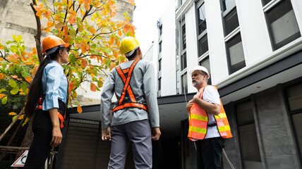 Back view Asian man manager and team inspection quaility work of worker cleaning windows service on high rise building. Industrial climber. Unity and teamwork concept © NVB Stocker