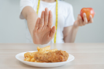 Beauty slim female body confuse fat food. Woman in restaurant achieves weight loss goal for healthy life, low calorie, thin waist, nutritionist. Diet, body shape, balance control, avoid, nutritionl.