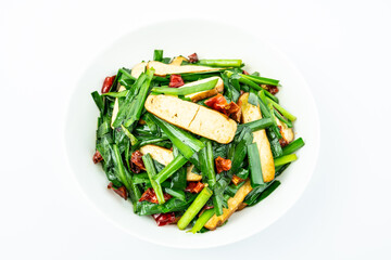 Fried fragrant dried chives on a plate on a white background