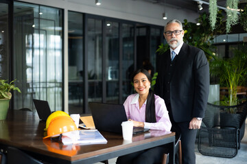 Architect and contractor team working meeting. Business people and real estate agent brokers company meeting and discussion plan on laptop computer at workplace