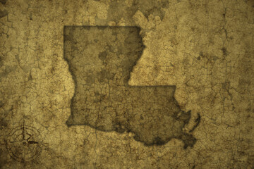map of louisiana state on a old vintage crack paper background .