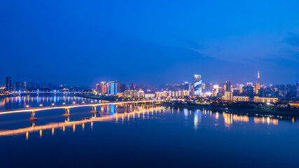 Fototapeta na wymiar Night scene on both sides of the Xiangjiang River in Zhuzhou, China