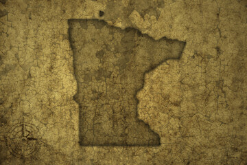 map of minnesota state on a old vintage crack paper background .