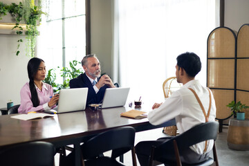 Young man employee during job interview at office workplace