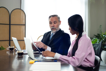 Obraz premium woman secretary. Smiling Asian female secretary gives CEO senior business owner paper documents