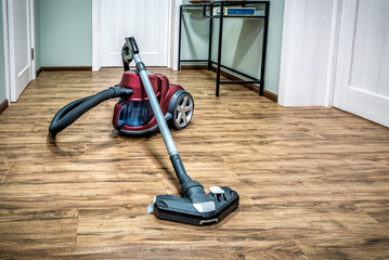Professional vacuum cleaner on ceramic tiles floor