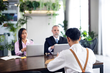 Fototapeta premium Young man employee during job interview at office workplace