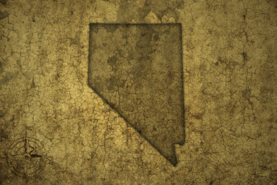 map of nevada state on a old vintage crack paper background .