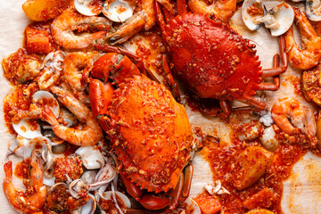 Crab sauce padang (Indonesian Kepiting Saus Padang). dish of crab served in hot and spicy Padang sauce.