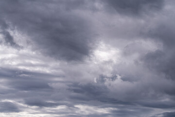 Dramatic cloudy sky portraying moody atmosphere with mystical cloud formations.