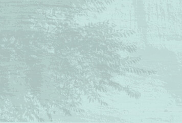 Natural light casts shadows from a leaves branches of tree. Top view of the shadow of tree leaves on a textured blue colored background. He was lying flat