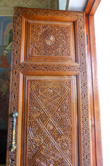 Beautiful geometric patterns carved into a wooden door
