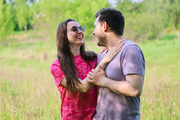 happy young couple in love.People look at the camera.Hugs and romance.Real emotions.Happiness and joy.Romantic date in nature.young people smiling.
picnic in nature.happy.joyful people.
happy life.