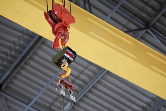 Hook of construction crane with electric sensor.