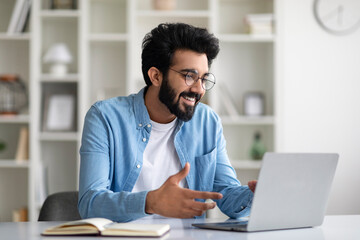 Young Indian Freelancer Guy Making Video Call With Laptop At Home