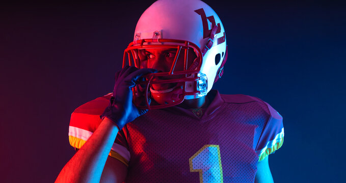American football player. Download high resolution photo for sports design. Horizontal banner in neon colors. Mockup for betting advertisement.