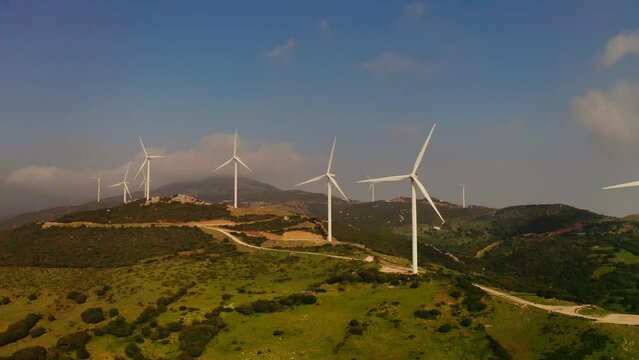 Windmills On Hills. Wind Spins Them Generate Electricity.