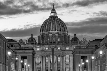 Fototapeta na wymiar Black and white Saint Peter's Basilica in Vatican City and Ponte Vittorio Emanuele II bridge at night with moon. Rome Italy Europe
