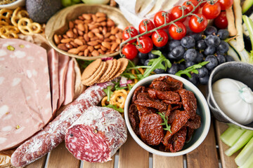  Fresh bread, pastries. Table full of mediterranean appetizers, tapas or antipasto. Assorted Italian food set. Delicious snack on party or picnic time. Italian style banquet. 
