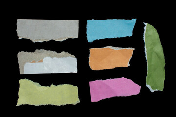 Set of torn paper pieces isolated on black background. Ripped papers for your designs.