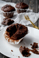 Chocolate muffin on a white plate