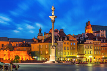 Castle Square with Royal Castle, colorful houses and Sigismund Column in Old town at night, Warsaw,...