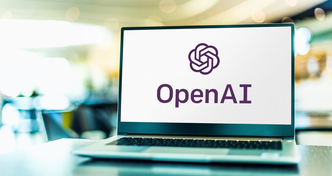 Laptop computer displaying logo of OpenAI