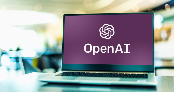 Laptop computer displaying logo of OpenAI