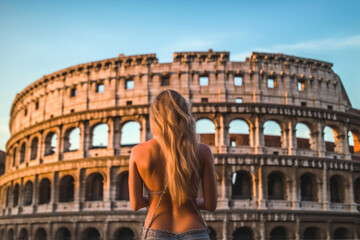 Back of blonde sexy woman against Colosseum, Rome, Italy.  Tourist girl visit italian famous landmark. Generative AI.