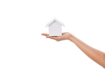 Hand holding a wooden house.