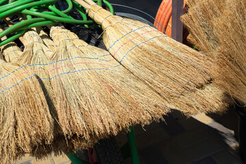 Brooms backgrounds. Sale of natural panicles.