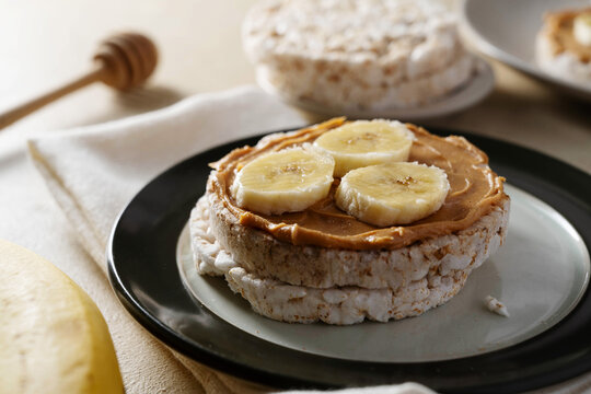 Rice cake with banana and peanut butter, healthy protein snack