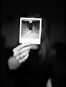 Woman holding polaroid shot