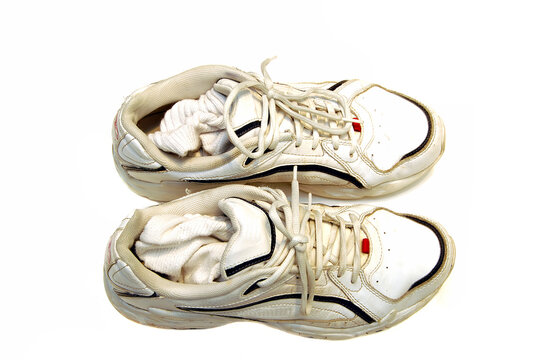 A pair of sneakers against a ahite background