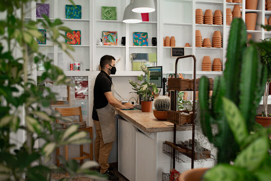 Employee at cashier in small business