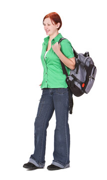 Redheaded teenage backpacker against a white background.