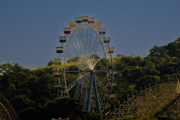 Hopi Hari park toys. Roller coaster and Ferris wheel at the amusement park.