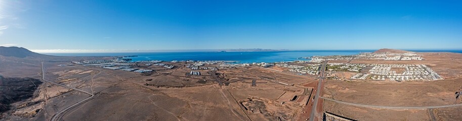 Drone panorama picture over Playa Blanca vacation village in Lanzarote
